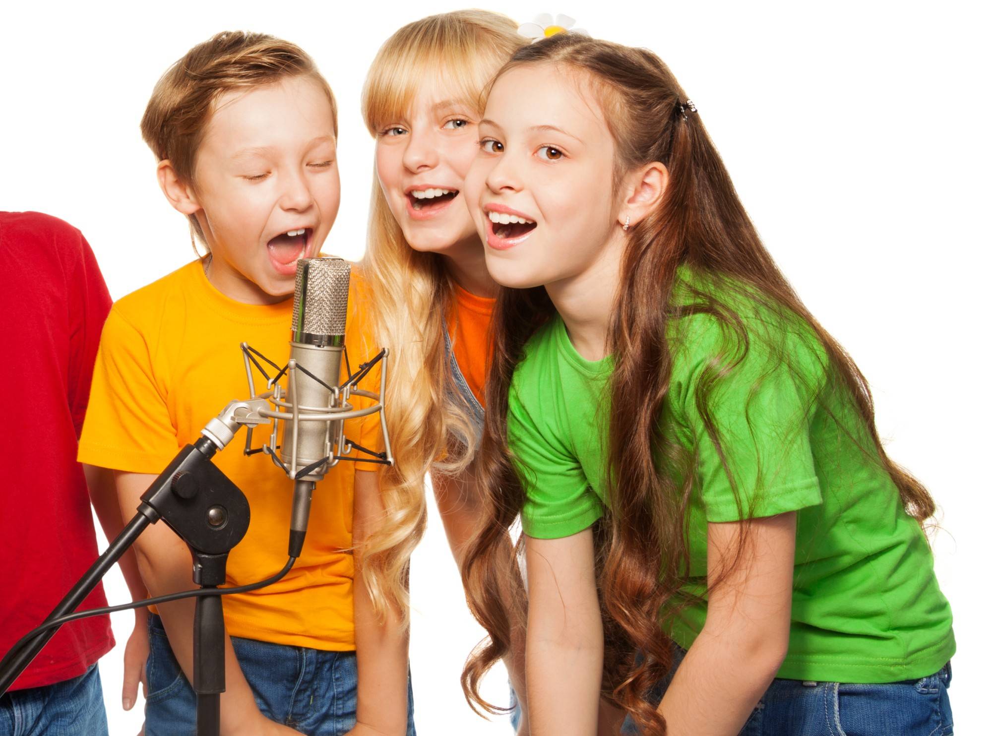 Boys and girls singing in microphone